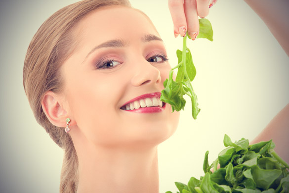 Happy-woman-eating-Spinach